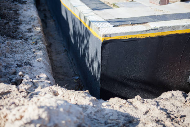 Professional Basement Waterproofing technician working in Milledgeville, GA